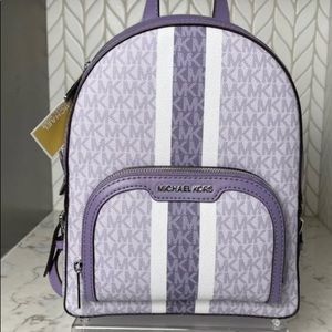 Purple Michael Kors backpack with wallet
